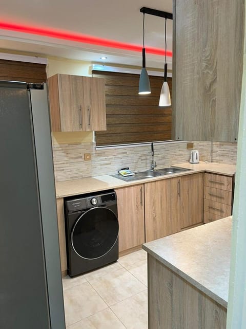 Kitchen or kitchenette, stove, washing machine