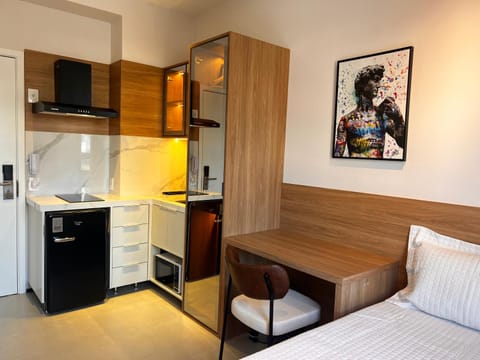 Photo of the whole room, minibar, oven, stove, wardrobe