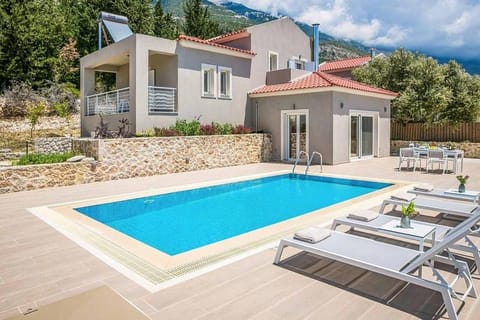 Property building, Patio, Pool view, Swimming pool, sunbed