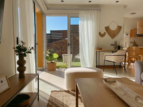 Living room, Seating area, Garden view, Pool view