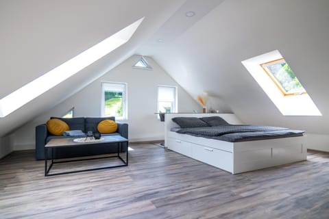 Bed, Living room, Seating area, Bedroom