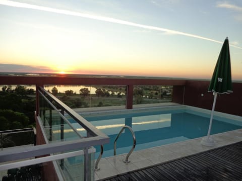 View (from property/room), Pool view, River view, Swimming pool, Sunset