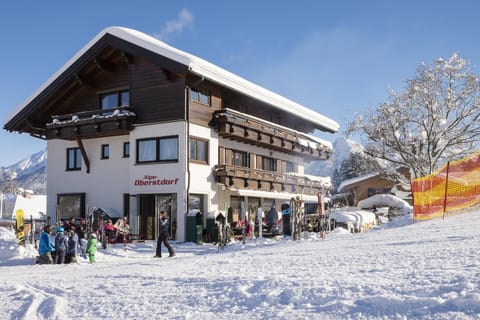 Property building, Facade/entrance, Day, People, Natural landscape, Winter, Skiing, group of guests