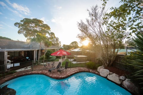 Property building, Natural landscape, Garden, Swimming pool, Sunset, sunbed