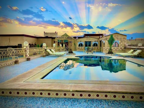 Property building, Day, Natural landscape, Pool view, Swimming pool, sunbed