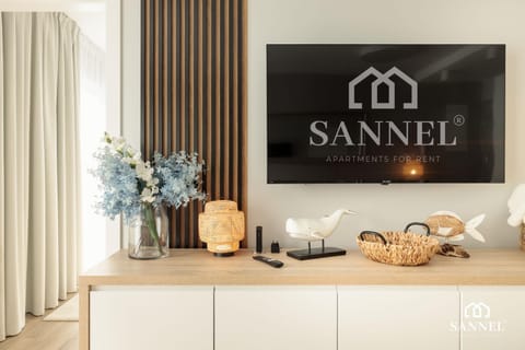Property logo or sign, TV and multimedia, Living room, Decorative detail, Evening entertainment