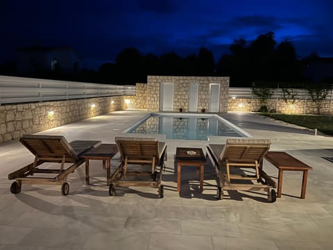 Patio, Night, Pool view, Swimming pool, sunbed