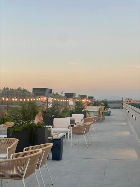 View (from property/room), Balcony/Terrace, Seating area, Sunset