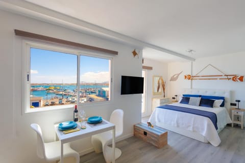 Communal lounge/ TV room, Bed, Natural landscape, TV and multimedia, View (from property/room), Photo of the whole room, Seating area, Dining area, Bedroom, Sea view, towels