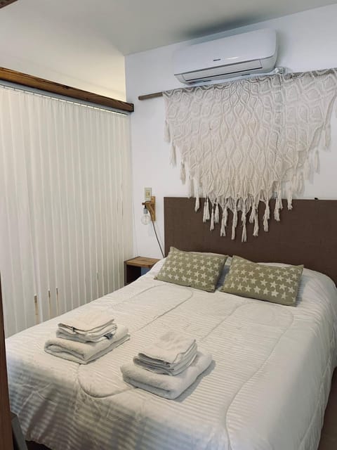 Bed, Photo of the whole room, Bedroom, towels, air conditioner
