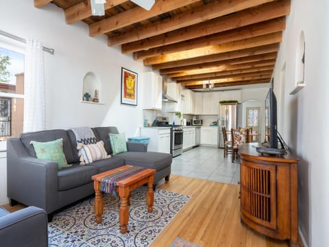 TV and multimedia, Kitchen or kitchenette, Living room, Seating area, furniture, microwave