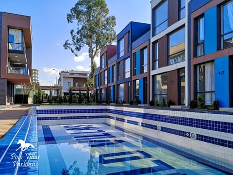 Property building, Day, Pool view, Swimming pool, sunbed