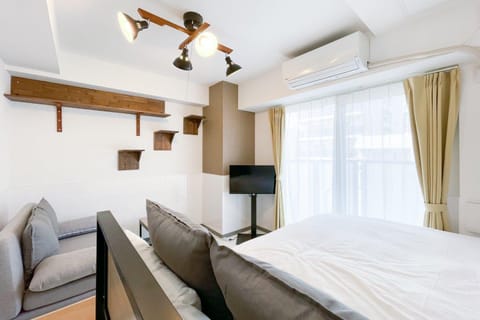 Bed, TV and multimedia, Seating area, Bedroom, air conditioner
