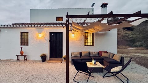 Property building, Patio, Day, Living room, Seating area, Dining area