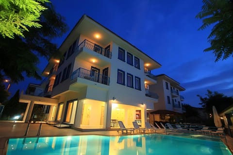 Property building, Patio, Night, Pool view, Swimming pool, sunbed