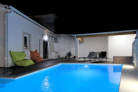 Property building, Patio, Night, Pool view, Swimming pool, Swimming pool, sunbed