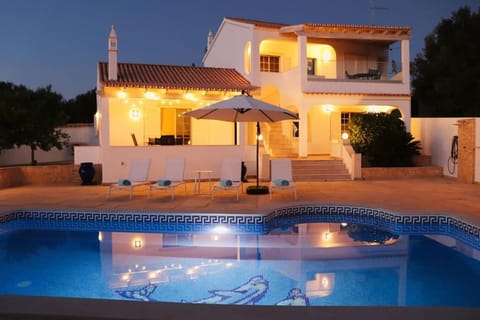 Property building, Patio, Night, Swimming pool, sunbed