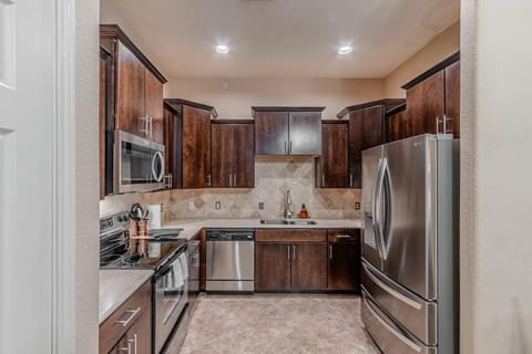 Kitchen or kitchenette, dishwasher, oven, stove