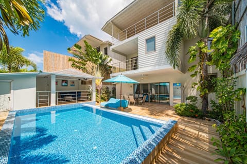 Property building, Patio, Pool view, Swimming pool, sunbed