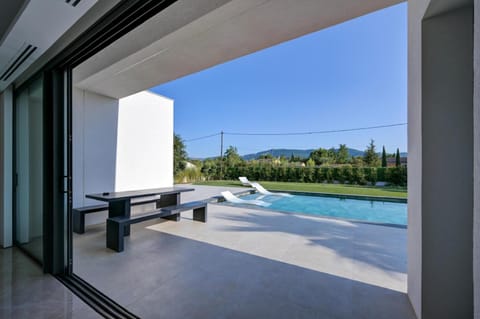 Patio, Day, Natural landscape, Pool view, Swimming pool, sunbed