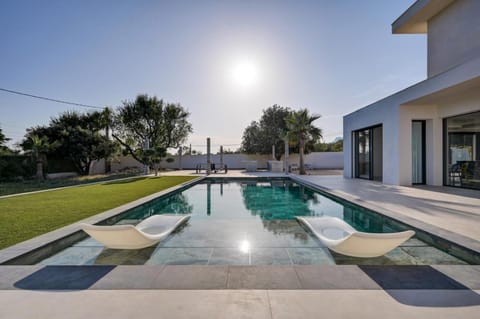 Patio, Day, Natural landscape, Pool view, Swimming pool, sunbed
