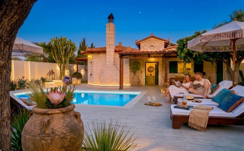 Property building, Patio, Natural landscape, Garden, Seating area, Garden view, Swimming pool, sunbed