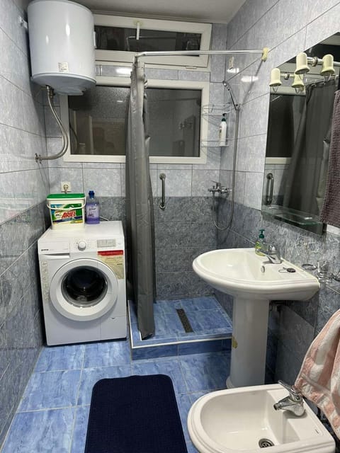 Shower, Toilet, Bathroom, towels, washing machine, dryer