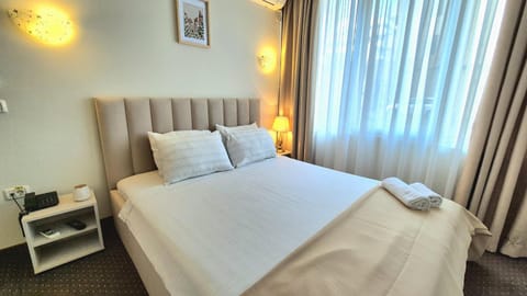 Bed, Photo of the whole room, Bedroom, towels, air conditioner