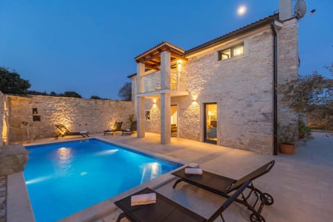 Patio, Night, Pool view, sunbed