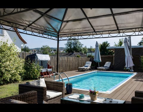 Property building, Living room, Swimming pool