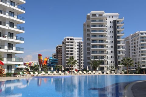 Property building, Communal lounge/ TV room, Day, Evening entertainment, City view, Pool view, Swimming pool, sunbed