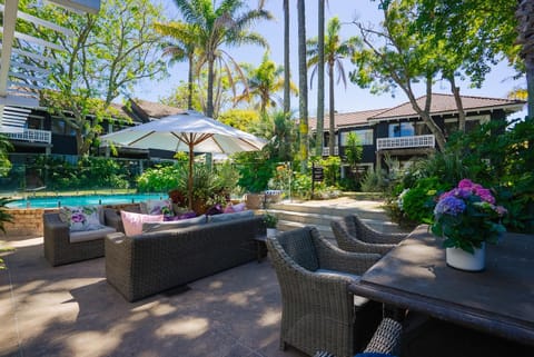 Patio, Spring, Day, Natural landscape, Garden, Seating area, Garden view, Pool view, Swimming pool, sunbed