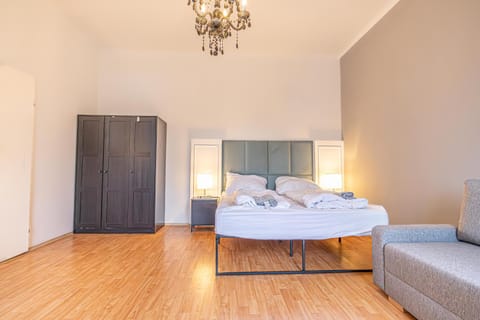 Bed, Seating area, Bedroom, towels, wardrobe