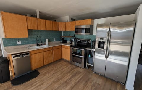 Kitchen or kitchenette, dishwasher, oven, stove, toaster