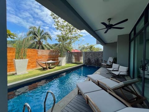 Patio, Seating area, Swimming pool, sunbed