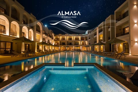 Property building, Night, Text overlay, Pool view, Swimming pool