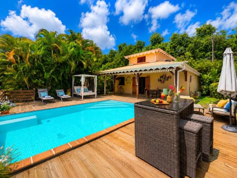 Property building, Patio, Day, Pool view, sunbed