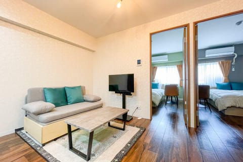 Communal lounge/ TV room, Bed, TV and multimedia, Living room, Photo of the whole room, Seating area, Bedroom