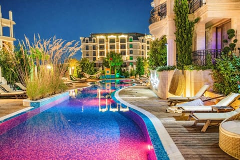 Property building, Night, Swimming pool, Swimming pool, sunbed