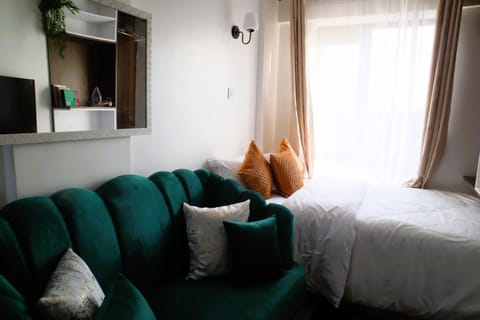 Bed, Living room, Seating area, Bedroom