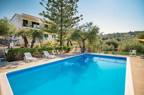 Property building, Pool view, Swimming pool, sunbed