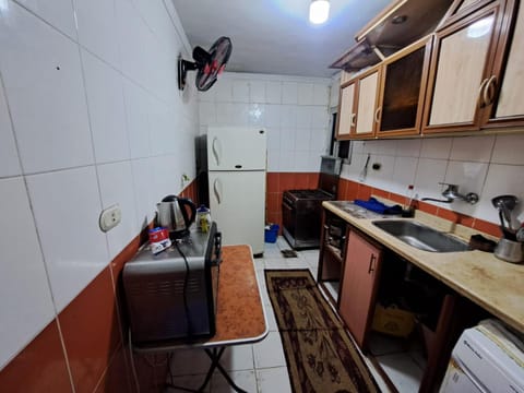 Kitchen or kitchenette, oven, stove
