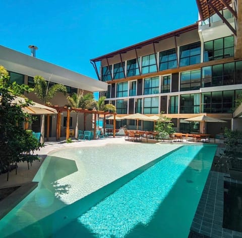 Property building, Day, Pool view, Swimming pool, sunbed