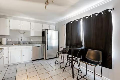 Kitchen or kitchenette, dishwasher, oven, stove