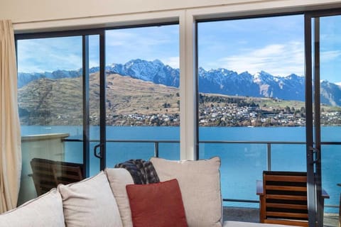View (from property/room), Balcony/Terrace, Living room, Seating area, Lake view, Mountain view