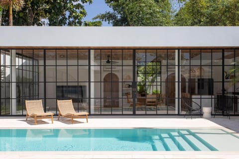 Property building, Patio, Pool view, Swimming pool, sunbed