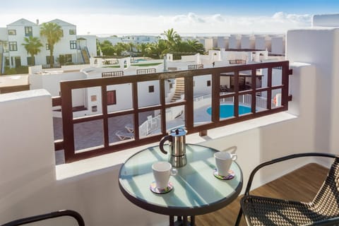 View (from property/room), Balcony/Terrace, Pool view, Swimming pool