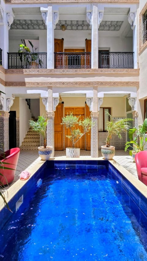 Property building, Patio, Day, View (from property/room), Balcony/Terrace, Living room, Seating area, Pool view, Swimming pool, sunbed