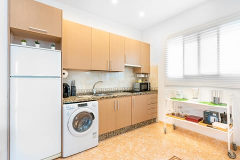 Kitchen or kitchenette, stove, washing machine, kitchen