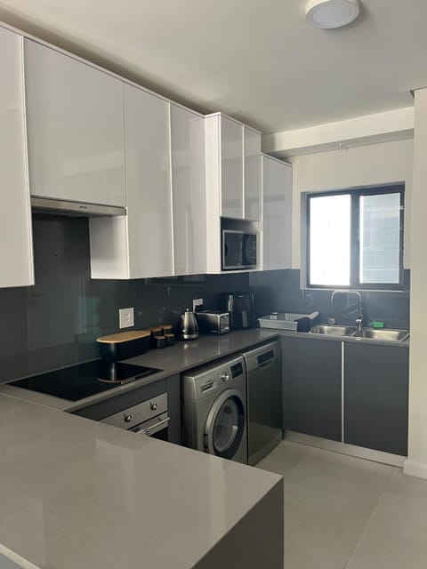 Kitchen or kitchenette, dishwasher, stove, toaster, washing machine